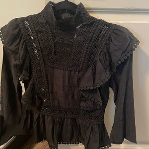 Simon’s black and laced peplum top